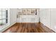 Bedroom with a closet, shelves with decorations, and dark wood floors at 7185 Ranchito Cir, Las Vegas, NV 89120