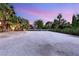 Large front yard with gravel and mature landscaping, offers an inviting space for outdoor activities at 7185 Ranchito Cir, Las Vegas, NV 89120