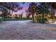 Spacious front yard offers potential for landscaping or outdoor features, complemented by mature landscaping at 7185 Ranchito Cir, Las Vegas, NV 89120