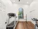 Bright gym featuring a treadmill, exercise bike, barre, and lots of natural light at 7185 Ranchito Cir, Las Vegas, NV 89120