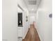Hallway leading to a laundry area with white cabinets at 7185 Ranchito Cir, Las Vegas, NV 89120