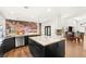 Gourmet kitchen featuring custom cabinets, large island, and high-end appliances at 7185 Ranchito Cir, Las Vegas, NV 89120