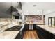 Modern kitchen featuring a gas range, stainless steel appliances, and marble countertops at 7185 Ranchito Cir, Las Vegas, NV 89120