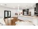 Open-concept view of the kitchen with dark cabinets and marble countertops at 7185 Ranchito Cir, Las Vegas, NV 89120