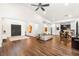 Spacious living room boasts hardwood floors and high ceilings with a ceiling fan at 7185 Ranchito Cir, Las Vegas, NV 89120