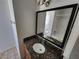 Bathroom with granite countertops, modern mirror, and single sink at 7300 Pirates Cove Rd # 2045, Las Vegas, NV 89145