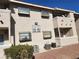 Tan building exterior with visible unit numbers and well-maintained landscaping at 7300 Pirates Cove Rd # 2045, Las Vegas, NV 89145