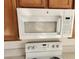 Kitchen area with stove and GE microwave at 7300 Pirates Cove Rd # 2045, Las Vegas, NV 89145