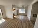 Spacious living room featuring wood floors and bright natural light at 7300 Pirates Cove Rd # 2045, Las Vegas, NV 89145