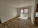Bright living room with a sliding glass door leading to a balcony at 7300 Pirates Cove Rd # 2045, Las Vegas, NV 89145