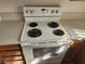White electric oven and stovetop combo featuring four burners and digital controls at 7300 Pirates Cove Rd # 2045, Las Vegas, NV 89145