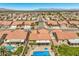 Gathering homes line this suburban community with backyard pools, patios and manicured lawns, aerial view at 7473 Crystal Clear Ave, Las Vegas, NV 89113