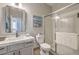 Bathroom featuring granite countertops and a frameless shower at 7473 Crystal Clear Ave, Las Vegas, NV 89113
