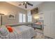 Bedroom with mirror closet doors, a ceiling fan, and neutral paint at 7473 Crystal Clear Ave, Las Vegas, NV 89113