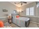 Bedroom showcasing stylish decor, including a bed with an orange accent pillow at 7473 Crystal Clear Ave, Las Vegas, NV 89113