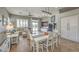 Bright dining area with a view of the living room and access to the backyard through sliding doors at 7473 Crystal Clear Ave, Las Vegas, NV 89113