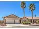 Charming desert home with mature palms, three-car garage, and xeriscaping at 7473 Crystal Clear Ave, Las Vegas, NV 89113