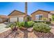 Well-maintained home with a three-car garage and low-maintenance desert landscaping at 7473 Crystal Clear Ave, Las Vegas, NV 89113