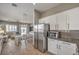 Well-appointed kitchen with stainless appliances, dining area, and seamless flow into the living space at 7473 Crystal Clear Ave, Las Vegas, NV 89113