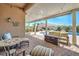 Comfortable covered patio with ample seating and a beautiful view of the pool at 7473 Crystal Clear Ave, Las Vegas, NV 89113