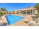 Sparkling pool and spa with an outdoor seating area, perfect for relaxing and entertaining at 7473 Crystal Clear Ave, Las Vegas, NV 89113