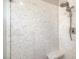 Contemporary shower with marbled walls and sleek fixtures at 7473 Crystal Clear Ave, Las Vegas, NV 89113