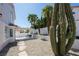 Beautiful backyard featuring a covered patio, desert landscaping, and a charming walkway at 7825 Desert Bell Ave, Las Vegas, NV 89128