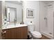 This bathroom features a modern sink vanity and tiled shower with glass door at 7825 Desert Bell Ave, Las Vegas, NV 89128