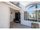 Inviting entryway with double doors, large windows, and desert-style planters at 7825 Desert Bell Ave, Las Vegas, NV 89128