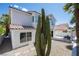 Lovely two-story home with desert landscaping, including a covered patio and rock garden in the backyard at 7825 Desert Bell Ave, Las Vegas, NV 89128