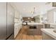Open concept kitchen with stainless steel appliances and hardwood flooring at 7825 Desert Bell Ave, Las Vegas, NV 89128