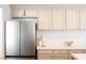 Bright kitchen featuring stainless steel appliances, ample cabinets, and decorative tile backsplash at 7825 Desert Bell Ave, Las Vegas, NV 89128