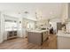 Spacious kitchen with center island, modern lighting and hardwood flooring at 7825 Desert Bell Ave, Las Vegas, NV 89128