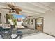 Inviting covered patio with stylish furnishings and a ceiling fan, perfect for relaxing and enjoying outdoor living at 7825 Desert Bell Ave, Las Vegas, NV 89128