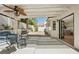 Charming covered patio with decorative flooring and access to the kitchen, ideal for entertaining guests at 7825 Desert Bell Ave, Las Vegas, NV 89128