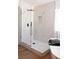 Sleek walk-in shower with modern fixtures and elegant tile work in a bright bathroom at 7825 Desert Bell Ave, Las Vegas, NV 89128