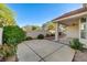 An expansive backyard with a covered patio and mature landscaping creates a tranquil outdoor retreat at 8052 Marbella Cir, Las Vegas, NV 89128