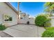 A cozy backyard area with a concrete patio, surrounded by mature landscaping, offers a private outdoor space at 8052 Marbella Cir, Las Vegas, NV 89128