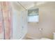Bathroom featuring a bathtub, shower, window and toilet at 8052 Marbella Cir, Las Vegas, NV 89128