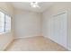 Bright bedroom with a window and double-door closet at 8052 Marbella Cir, Las Vegas, NV 89128