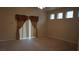 Bedroom with neutral carpet, window with curtains, and ample natural light at 8052 Marbella Cir, Las Vegas, NV 89128