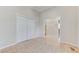 Bedroom with double-door closet and open doorway at 8052 Marbella Cir, Las Vegas, NV 89128