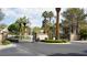 View of community entrance featuring manicured landscaping and decorative gate for a secure entrance to the neighborhood at 8052 Marbella Cir, Las Vegas, NV 89128