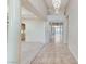 Inviting entryway with tiled floor and a view into other rooms creating a warm and open feel at 8052 Marbella Cir, Las Vegas, NV 89128