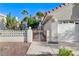 Charming single-Gathering home featuring a well-maintained yard, tile roof, and an attached two-car garage at 8052 Marbella Cir, Las Vegas, NV 89128