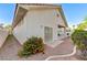 Exterior view showcases a private backyard with tiled patio access, enhanced by lovely garden areas at 8052 Marbella Cir, Las Vegas, NV 89128