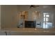 Living room fireplace featuring built-in shelving, offering both warmth and functional storage for a cozy space at 8052 Marbella Cir, Las Vegas, NV 89128