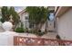 Front entrance adorned with mature landscaping, offering privacy and curb appeal at 8052 Marbella Cir, Las Vegas, NV 89128