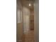 Hallway features tile flooring and convenient built-in cabinets at 8052 Marbella Cir, Las Vegas, NV 89128