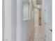 Tiled hallway with natural light, providing smooth transition between rooms at 8052 Marbella Cir, Las Vegas, NV 89128